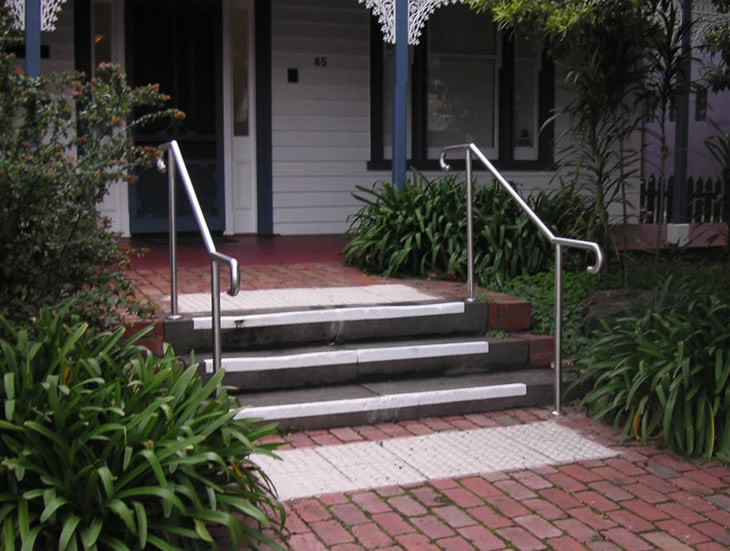 Stainless steel rails on concret steps